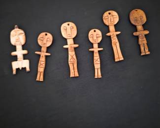 Hand carved bone figures from Africa