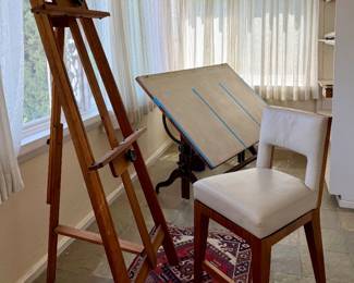 Artist, painting, easel and drafting table