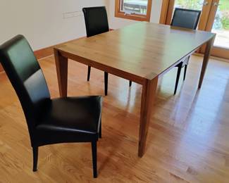 Six Italian leather dining chairs. Table not for sale.