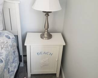 Nightstand; table lamp