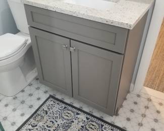 Updated bath vanity; toilet