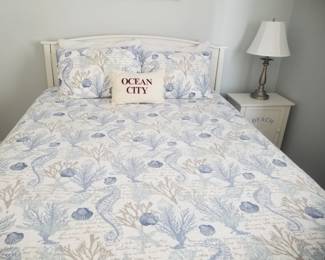 Queen bed; nightstand; table lamp 