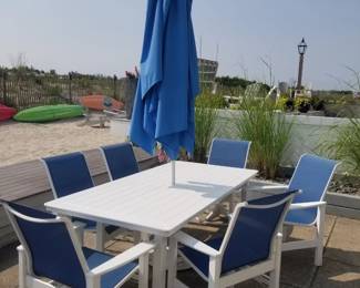 Polyresin dining set seats 6 - 2 swivel captain's chairs; 4 side chairs; rectangular umbrella