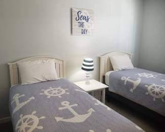 Twin beds; table; table lamp