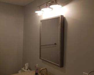 Mirrored medicine cabinet; vanity lights