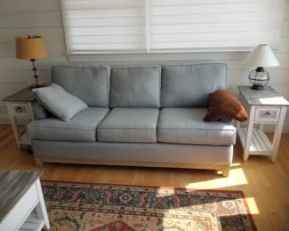 Cozy couch; end tables; table lamps