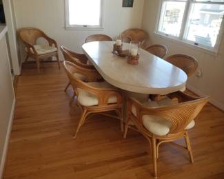 Stunning laminate dining table expands to seat 12. 8 rattan pencil reed chairs
