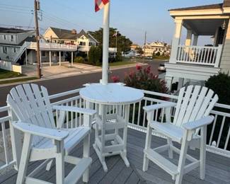 Polyresin high top table & 2 chairs; flagpole