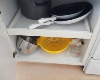 Kitchen cabinetry: pull out shelves. Cookware