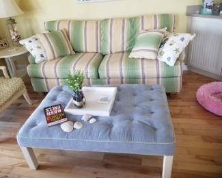 Striped couch is a sleeper sofa!; large upholstered ottoman/table