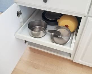 Kitchen cabinetry: pull out shelves. Pots & pans