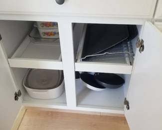 Kitchen cabinetry: pull out shelves. Pots & pans