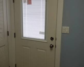 Entry door with internal blind