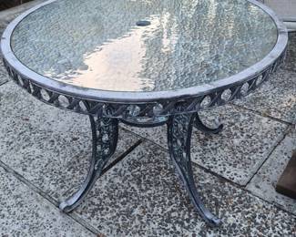 RoundGlassTopPatioTablewithOrnateIronFrame