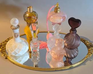 Mirrored tray and perfume bottles