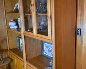Tall oak bookcases with glass cabinets