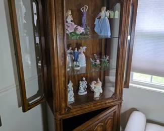 Curio cabinet with glass shelving, side door access and storage cabinet at the bottom