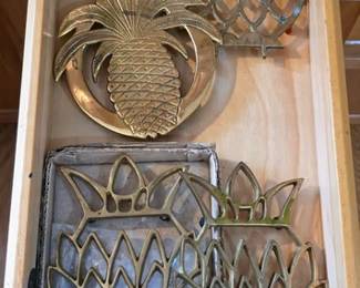 Brass trivets, owl and pineapples