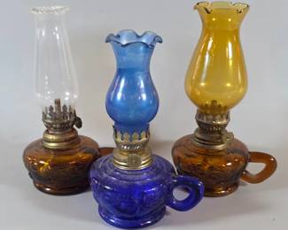 Wide variety of oil lamps, colored glass and milk glass and in many different shapes and sizes