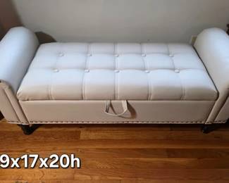 Faux leather tufted storage bench with nail head details