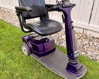 Amigo electric mobility scooter with adjustable padded seat, armrests, and easy-to-operate controls; ideal for indoor or outdoor personal mobility.