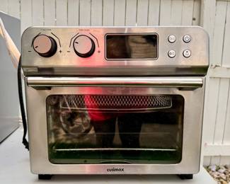 Cusimax stainless steel countertop air fryer/toaster oven with digital controls and multiple cooking functions.