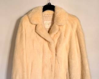 Elegant vintage genuine mink fur jacket from Leigh's of Grand Rapids (circa 1976), featuring luxurious craftsmanship and a warm ivory patina that has naturally developed with age.