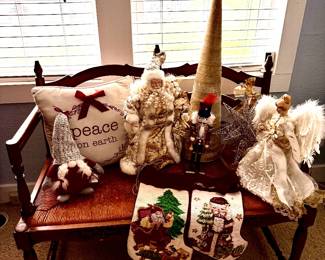 Beautiful assortment of Christmas and holiday décor featuring elegant Santas, angels, nutcrackers, stockings, decorative trees, stars, pillows, and seasonal accents. A wonderful collection for holiday decorating.