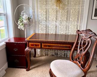 Beautiful executive writing desk with matching upholstered ornate wood chair.