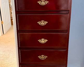 Elegant cherry-finish seven-drawer chest featuring classic brass hardware and plenty of storage in a timeless design.