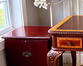 Cherry-finish two-drawer file cabinet with classic hardware, offering stylish organization for any home office.