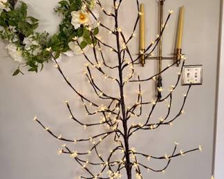Decorative LED cherry blossom tree that creates a warm, inviting glow for year-round home décor or special occasions.