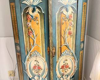 Striking Vergara-Art hand-painted armoire with elaborate polychrome floral decoration, original hardware, and vivid red-orange interior storage; handmade in Spain.