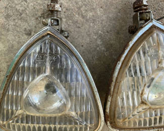 Lot 41: Vintage automotive headlights and round lamps