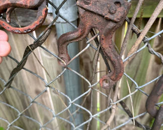 Lot 187: Antique hooks, bar, and chain hardware