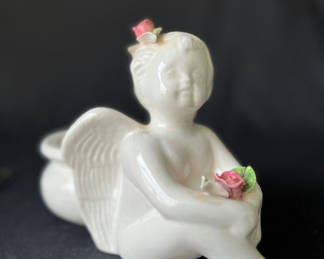 Lot 85: Ceramic angel planter, nesting heart dishes, and iridescent, Carnival Glass fruit bowl