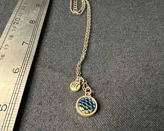 Lot 132: Silver-toned necklace with iridescent round pendant and 'BFF' charm