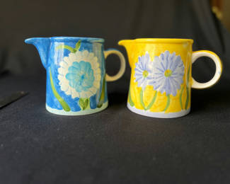Lot 89: Pair of small ceramic pitchers with blue and yellow floral glaze