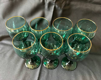 Lot 18: Vintage Green goblets with gold rims and clear champagne flutes