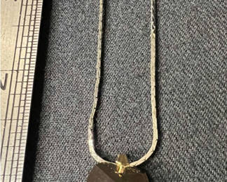 Lot 142: Two-tone pendant necklace set with purple heart and decorative charms