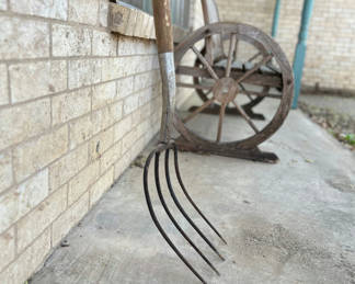 Lot 37: Antique shovels and pitch forks