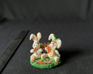 Lot 98: Two white bunny figurines with carrot basket