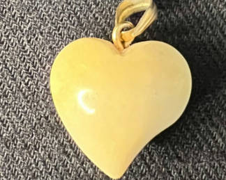Lot 152: Vintage Ivory heart pendant, duck charm ring, and green-bead ring