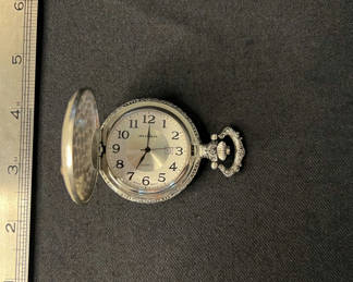 Lot 140: Assorted vintage jewelry set: ornate pocket watch, colorful bead necklaces, and pearl charm bracelet