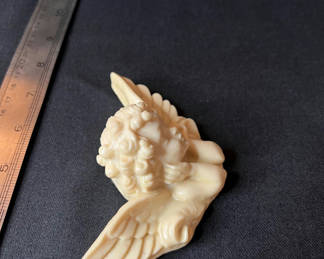 Lot 103: Cream-colored angel figurine and Angel music box