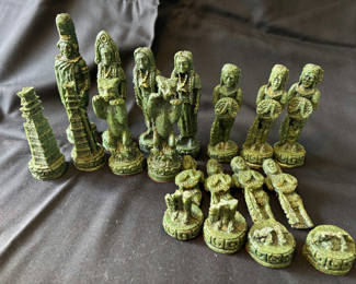 Lot 23: Vintage Aztec vs Conquistador chess pieces set