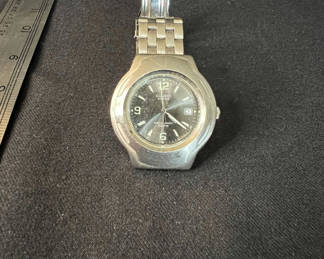 Lot 163: Vintage Casio Edifice EF-104 quartz watch and Vintage eagle-embossed lighter