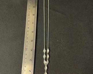 Lot 110: Silver-tone necklace with crystal drop pendant and two pairs of shell earrings (blue enamel and gold-tone)