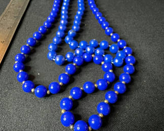 Lot 145: Beaded necklace collection in blue, black and gold tones
