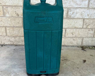 Lot 48: Coleman camping lantern and matching green fuel container